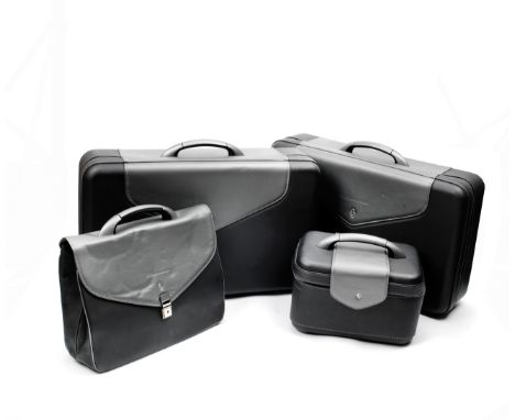 A four-piece set of leather luggage for Ferrari 575M Maranello by Schedoni, Italian,each in two-tone black and grey with grey