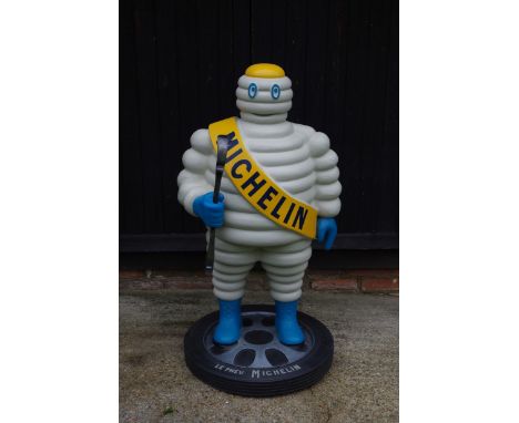 A HAND-PAINTED 'MR BIBENDUM' STANDING FORECOURT FIGURE,modern, fibreglass construction, wearing 'Michelin' sash, 120cm high T