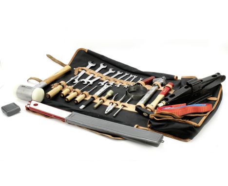 A reproduction Ferrari 275 GTB/4 toolkit,black leatherette bag and roll, with tan leather edging and straps, opening to assor