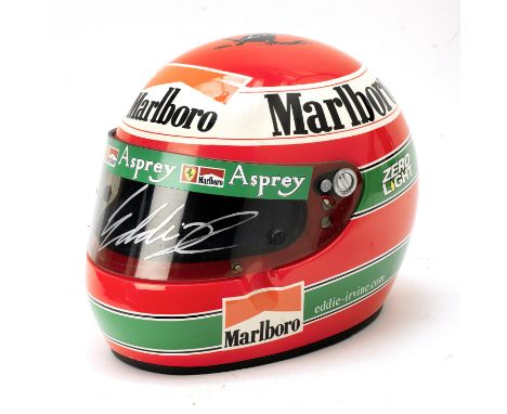 An Eddie Irvine Ferrari promotional helmet by Bieffe, with signed visor,painted bright red with green hooped livery, with Mar