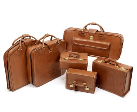 A six-piece leather luggage set for Ferrari Testarossa, by Schedoni, Italian,each in brown leather with tan lining, comprisin