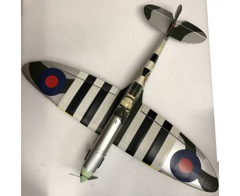 A flying scale model of a Supermarine Spitfire Mk IXc,balsa wood construction with vinyl skin in D-Day Invasion Stripe camouf
