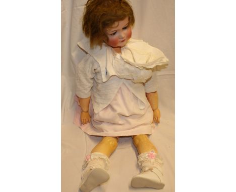 A large porcelain head doll by Otto Dressel of Germany with composition jointed body, 29" long  