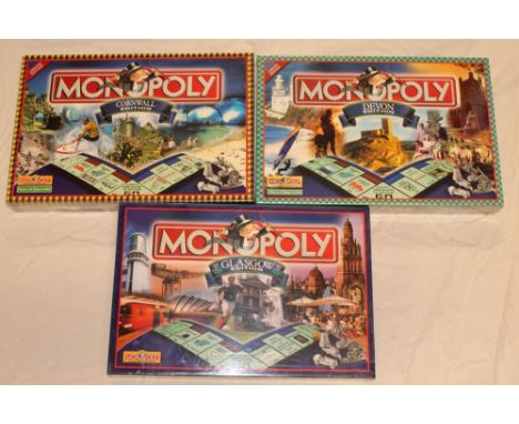 Three sealed and unopened Monopoly board games including Cornwall Edition, Devon Edition and Glasgow Edition (3) 