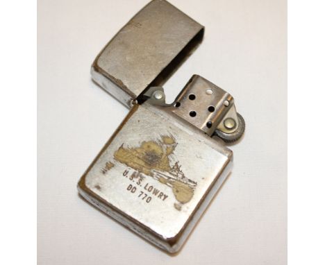 An original Vietnam War era USS Lowry Zippo lighter, dated coded 1966