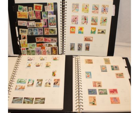 Three folder albums containing a collection of Vietnam stamps, North and South Vietnam etc 