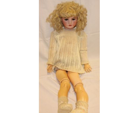 A child's porcelain-headed doll by Simon & Halbig with composition jointed body, 31" long 