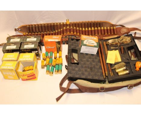 A selection of twelve bore shotgun cartridges, cartridge belts, cleaning kit and a small selection of twenty bore shotgun car