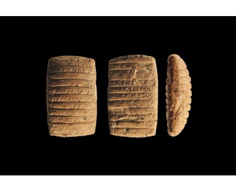 2340–2200 BC.
A terracotta pillow-shaped tablet with cuneiform text to two broad faces and one edge, with deep interstitial l