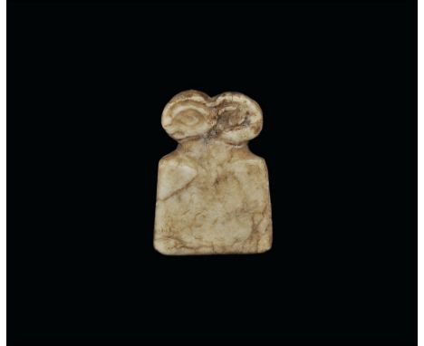 3rd millennium BC.
An alabaster idol, flat in section, with trapezoidal body and two large lentoid eyes above. 10 grams, 42mm