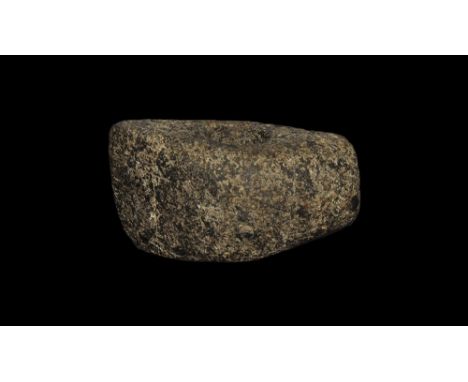 Neolithic, 4th-3rd millennium BC. 
A dolerite axe-hammer with one striking surface and one keeled edge, with cylinder perfora