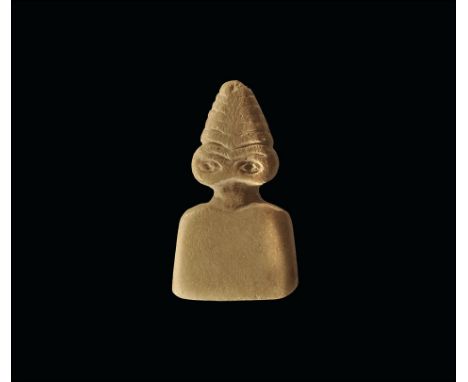 3rd millennium BC. 
An alabaster idol, flat in section, with trapezoidal body, two large lentoid eyes and six-stage hairstyle