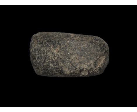 Neolithic, 3rd-2nd millennium BC. 
A small ground and polished boat-shaped axehead with sand-drilled perforation for hafting;