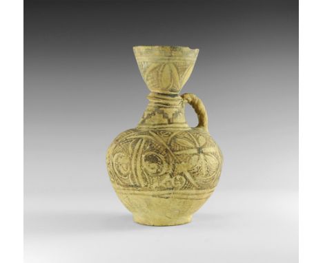 2nd millennium BC. 
A ceramic jug with biconvex body, flared base, bell-shaped shoulder, baluster and funicular mouth; twiste