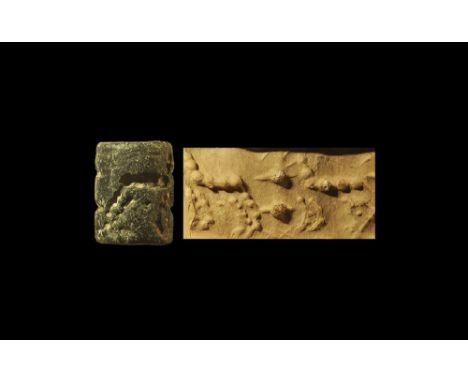 4th millennium BC. 
A steatite(?) cylinder seal with drilled frieze of beasts. 23 grams, 27mm (1") Fine condition.
Ex Rihani 