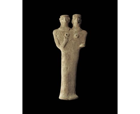 12th-8th century BC.
A ceramic figurine with columnar body and flared base, applied discs to the breasts, right arm flexed wi