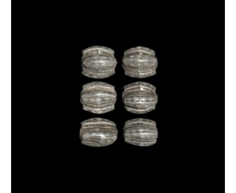 9th-11th century AD.
A group of six silver filigree beads, composed of four separate beads joined together to form each one; 