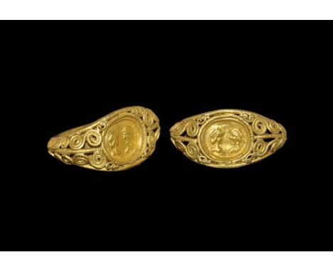 4th-5th century AD. 
A D-section gold hoop with raised borders, median beaded wire extending around the hoop and framing the 