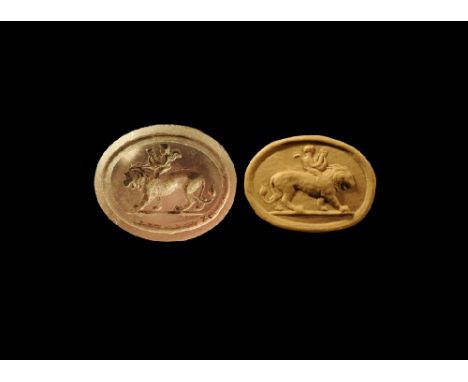 3rd-7th century AD. 
A drum-shaped amethyst seal matrix with intaglio image of an advancing lion with a putto on its back pla