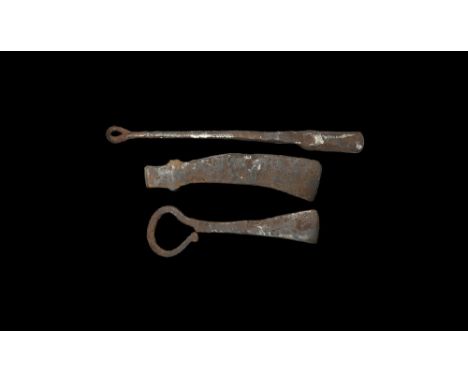 9th-11th century AD. 
A mixed group of miniature iron tools comprising: an axehead with curved blade; a soldering iron with r