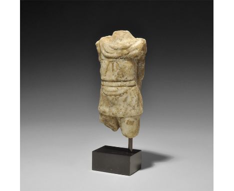 1st-2nd century AD.
A marble figure showing the torso and upper thighs of a male with military cloak at the shoulders and bac