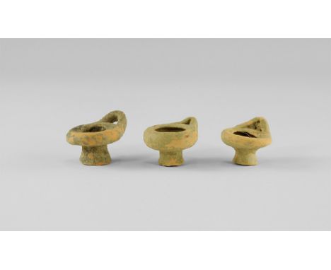 5th-3rd century BC.
A group of three miniature ceramic lamps, each with loop and flared base. 46 grams total, 42-51mm (1 3/4 