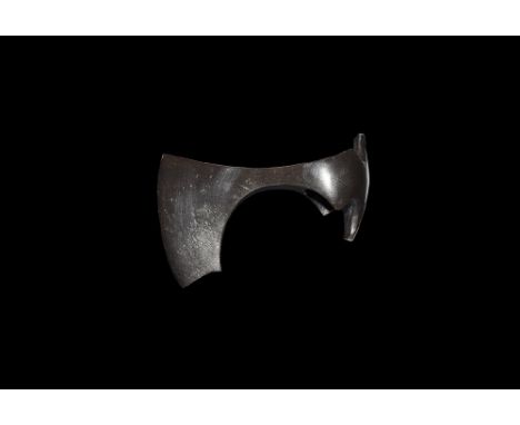 9th-11th century AD. 
An iron axehead with triangular-section blade widening to a broad bevelled edge with square chin, socke