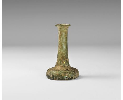 1st-3rd century AD.
A tall iridescent flask with squat , bulbous body, flaring rim. 60 grams, 80mm (3 1/4"). [No Reserve] Fin