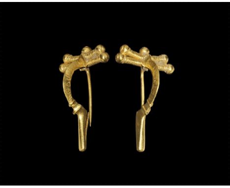 3rd century AD. 
A gold P-shaped bow brooch with headplate formed as two faux-springs and knop above, deep triangular-section