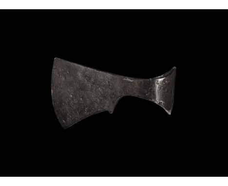 9th-12th century AD. 
An iron bearded axe with flaring socket, sloping blade to the upper surface with angular bottom with pr