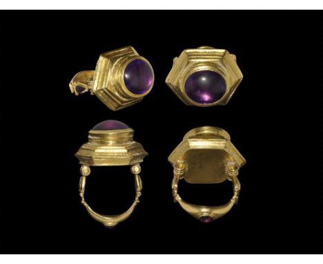 3rd-1st century BC. 
A large gold two-part finger ring comprising: a carinated D-section balustered lower section with waiste