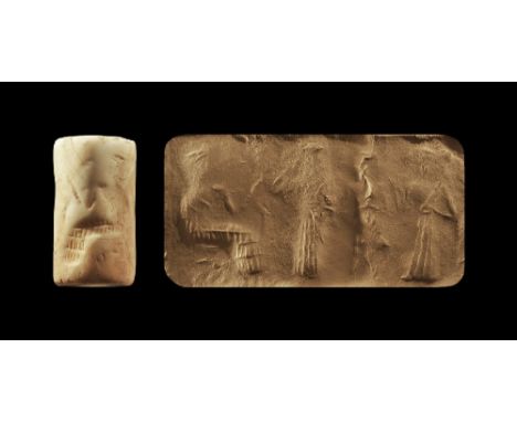 2250-2150 BC.
A shell cylinder seal with frieze of figures; accompanied by an old scholarly note, typed and signed by W.G. La