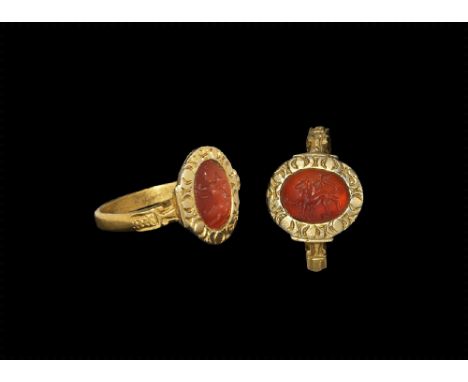11th-12th century AD.
A D-section gold hoop with scrolls to the shoulders, discoid plaque with amuletic cross and crescent mo