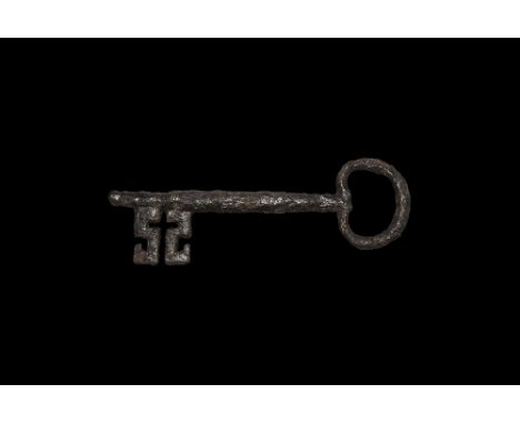 14th-15th century AD.
An iron door-key with looped bow, round-section shank with stepped forward end, bit formed as two oppos