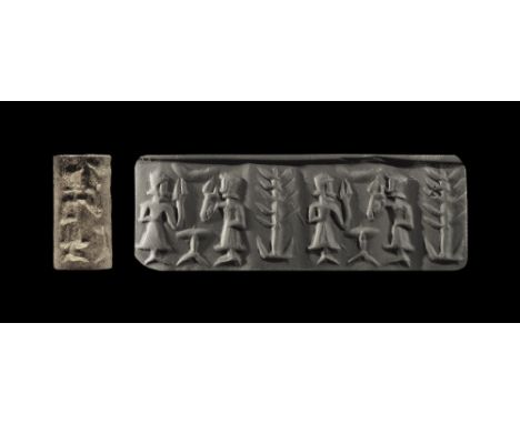 2200-2100 BC. 
A limestone cylinder seal with figural frieze; accompanied by a museum-quality impression and typed and signed