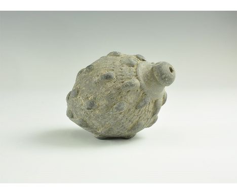 9th-11th century AD. 
A hollow ceramic vessel, biconical in shape, intended to be filled with explosive liquid and a wick, an