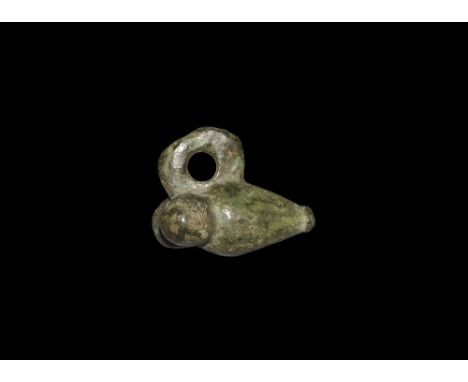 1st-2nd century AD.
A bronze phallic pendant with pierced flange above. 35 grams, 32mm (1 1/4").Fine condition.
Property of a