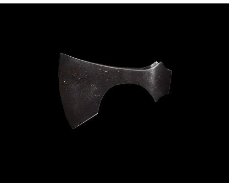9th-11th century AD. 
An iron axehead with triangular-section blade widening to a broad bevelled edge with square chin, socke