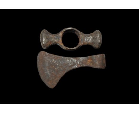 13th-15th century AD.
A pair of iron tools comprising: a small axehead with curved blade; a hammer-head with flared wings to 