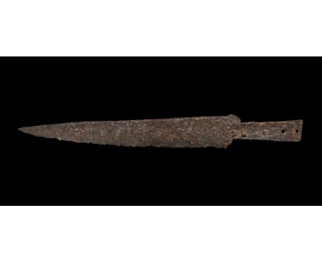 12th-14th century AD. 
A single-edged iron scale-tang knife with triangular blade, recess to one face of the tang, five rivet