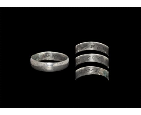 16th century AD. 
A flat-section silver hoop with inscription to the inner face in seriffed capitals 'MY = HART = YOV = HAVE'