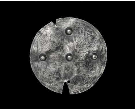 Late 9th-10th century AD. 
A Viking or Anglo-Scandinavian flat-section discoid silver plaque with incised niello-filled ornam