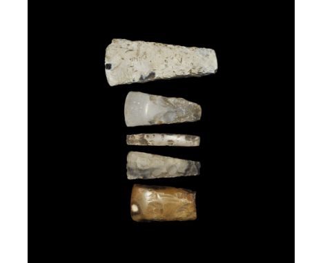 Neolithic, 5th-3rd millennium BC.
A mixed group comprising: a large polished thick-butted axe with squared tapering sides, sq