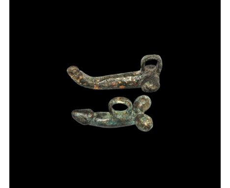 1st-2nd century AD.
A pair of bronze phallus pendants each with suspension loop to the upper face. 30 grams total, 36-42mm (1