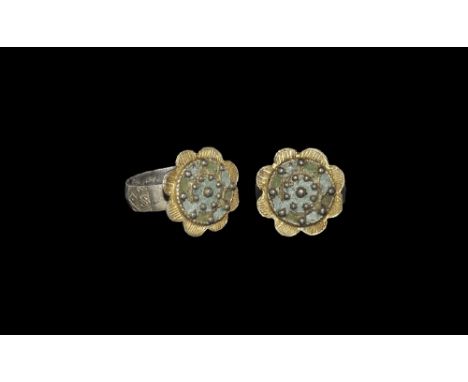 18th-early 19th century AD. 
A carinated broad silver hoop with hexagonal pad to the underside, steed shoulders, parcel-gilt 