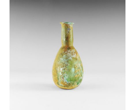 2nd-4th century AD. A large green glass vessel with bulbous body, flat base, waisted neck and everted folded rim; some irides