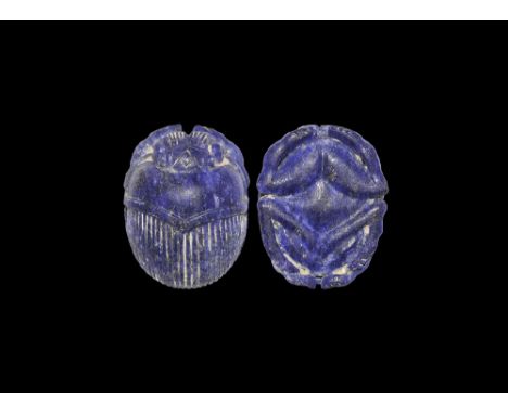 Late Period, 664-332 BC. 
A large finely carved lapis lazuli scarab with detailed carapace, mouth parts and legs; plain under