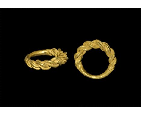 9th-11th century AD. 
A substantial round-section gold hoop, the upper section formed as two double-strands twisted. 22 grams