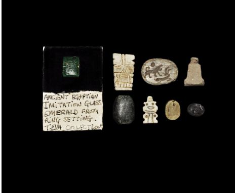 Late Period, 664-332 BC. 
A mixed group of glazed composition pendants and beads including a figure of Bes, three scaraboids;