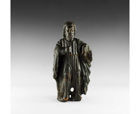 15th century AD. 
A carved wooden architectural figure of a saint(?) or dignitary in loose robes, with neat beard and styled 